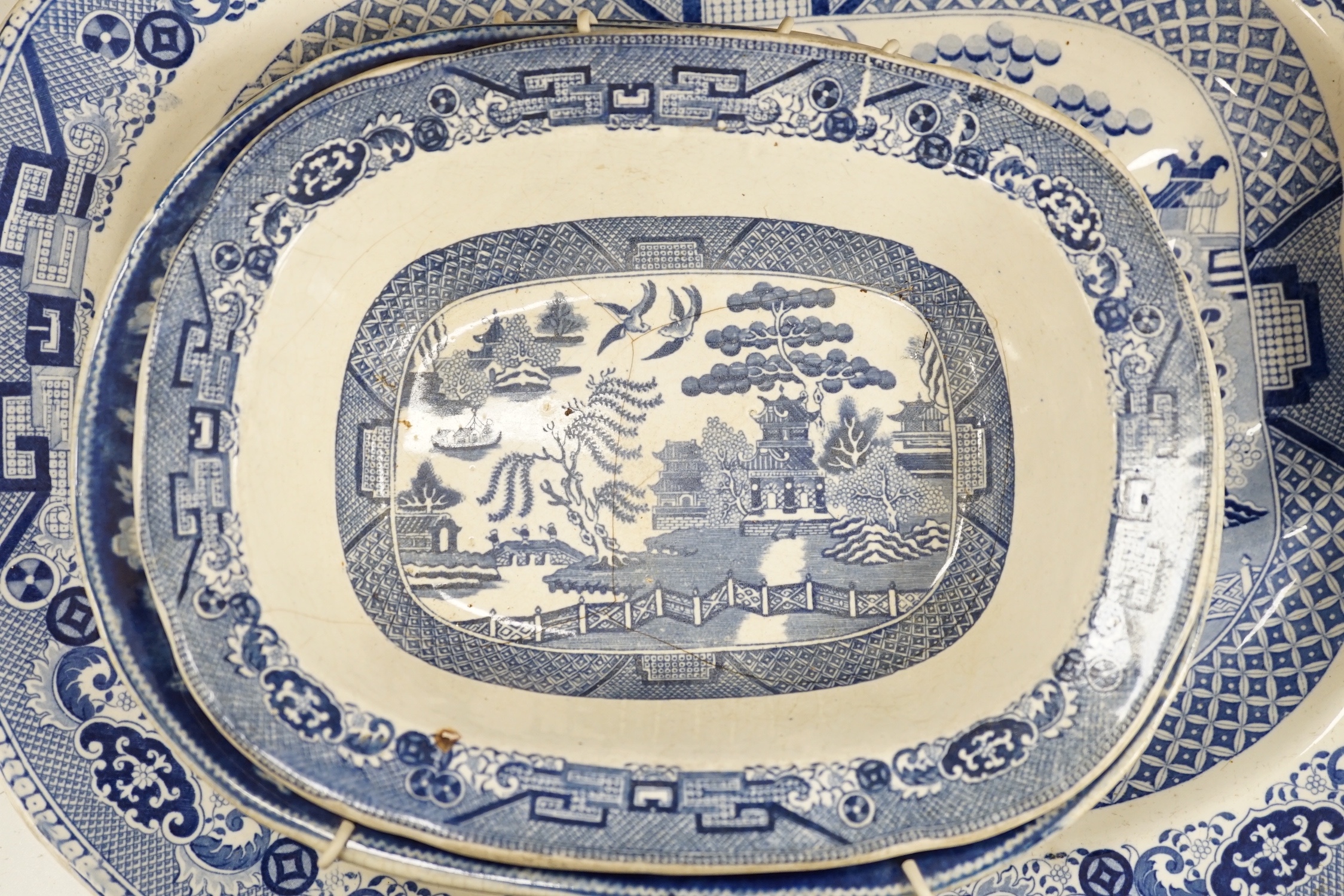 A 19th century blue and white meat platter and four similar dishes